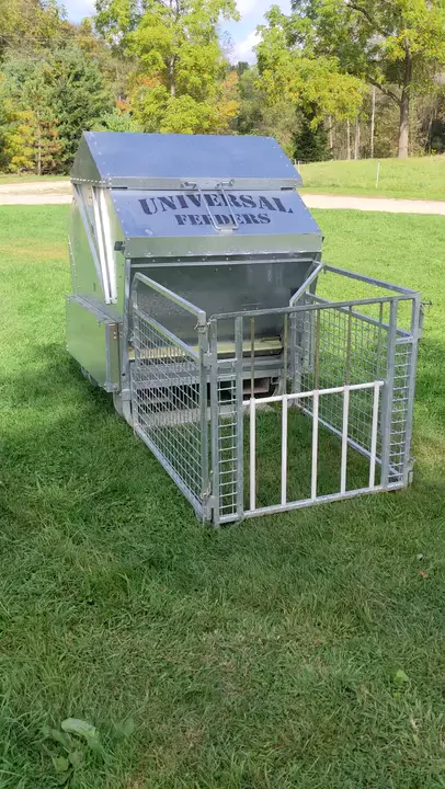 Universal Feeders creep feeder in a pasture
